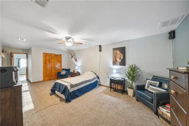 a bedroom with furniture and a window