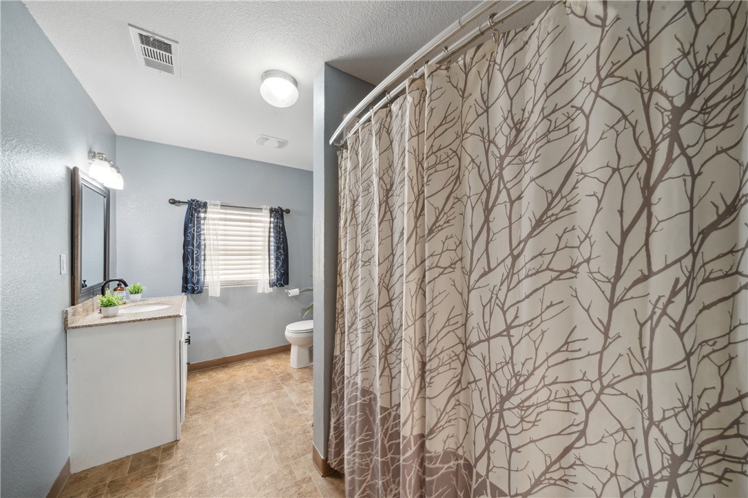 740 Bridget Avenue Buffalo, TX 75831 - Photo 23 of 42 a view of a bathroom with sink and mirror