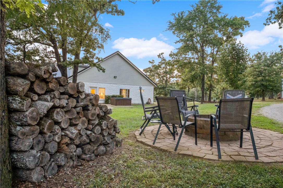 740 Bridget Avenue Buffalo, TX 75831 - Photo 28 of 42 a view of a backyard with table and chairs and potted plants with large tree