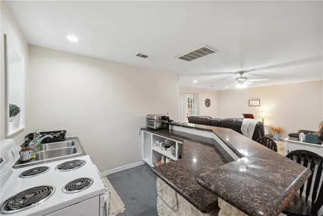 an aerial view of a houses with a yard