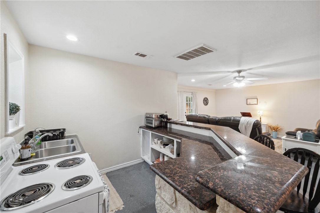 740 Bridget Avenue Buffalo, TX 75831 - Photo 42 of 42 a kitchen with a stove and a sink