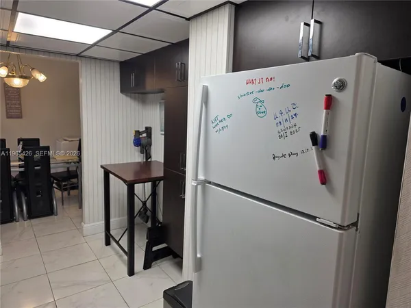 a living room with furniture a flat screen tv and a rug