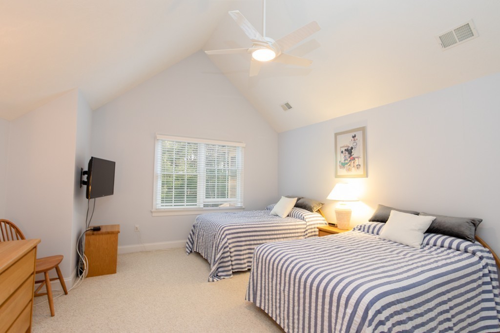 64 Gold Leaf Lane, Unit 64 Mashpee, MA 02649 - Photo 17 of 28 a bedroom with two beds and a window