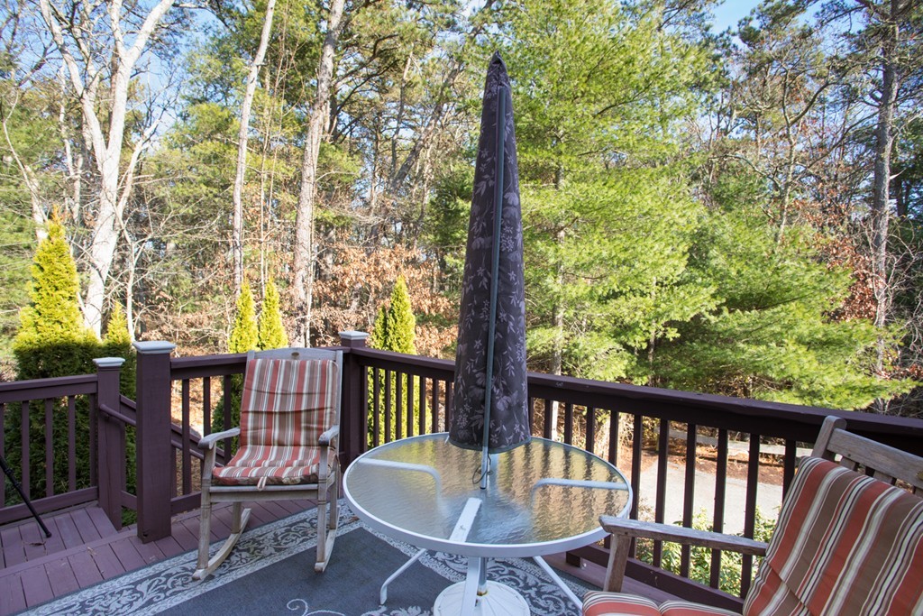 64 Gold Leaf Lane, Unit 64 Mashpee, MA 02649 - Photo 5 of 28 a view of a two chairs in the deck