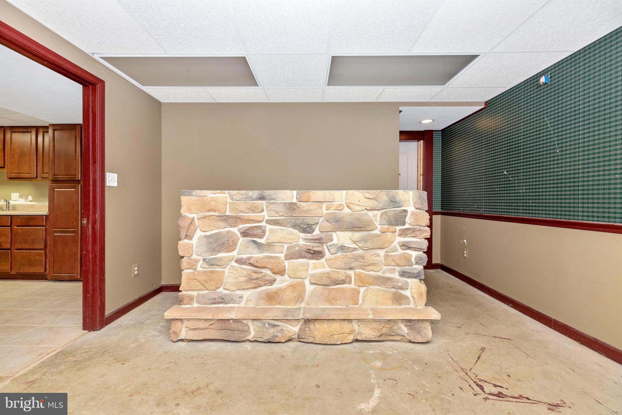 1562 Fridinger Mill Road Westminster, MD 21157 - Photo 20 of 37 LL recreation room, partially finished stone bar.