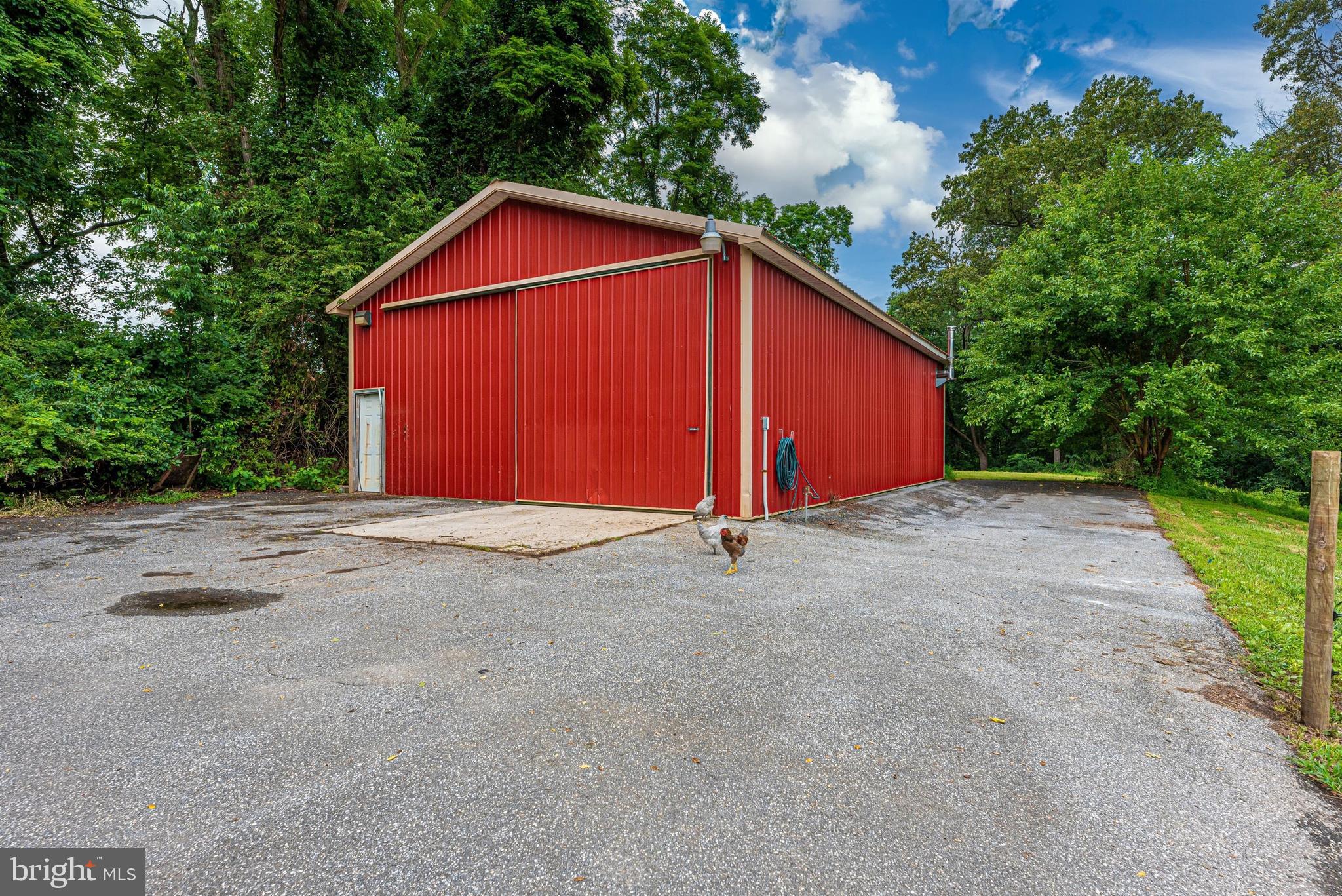 1562 Fridinger Mill Road Westminster, MD 21157 - Photo 31 of 37 Pole barn w propane furnace and 2 large sliders.