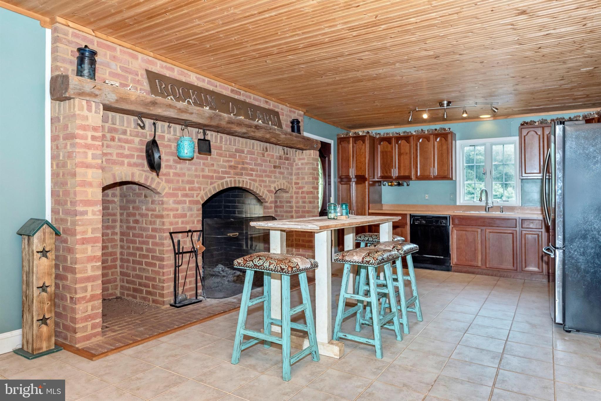 1562 Fridinger Mill Road Westminster, MD 21157 - Photo 5 of 37 Woodburning brick hearth and cozy kitchen