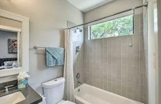 a bathroom with a toilet and a bathtub