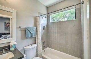 2403 Everett Street, Unit C Houston, TX 77009 - Photo 5 of 11 a bathroom with a toilet and a bathtub