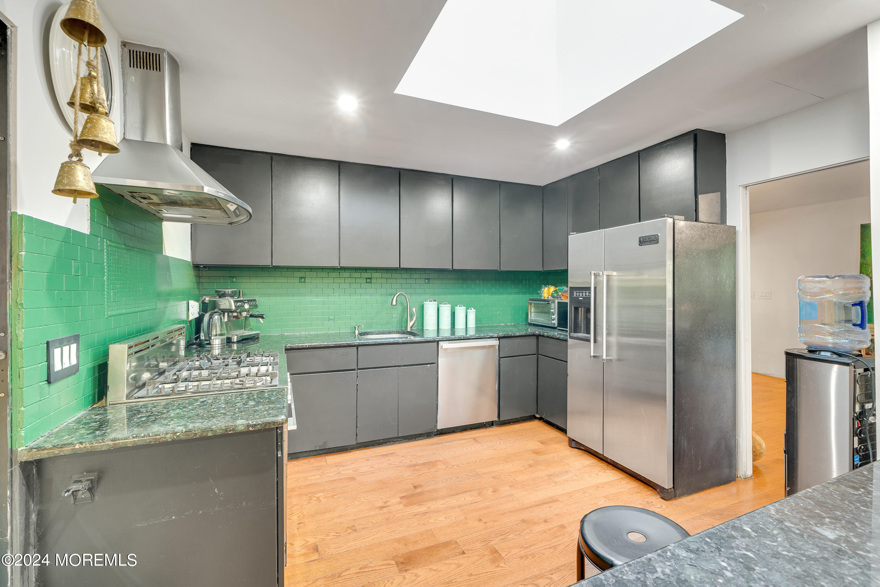77 Telegraph Hill Road Holmdel, NJ 07733 - Photo 11 of 31 a kitchen with stainless steel appliances granite countertop a refrigerator and a sink