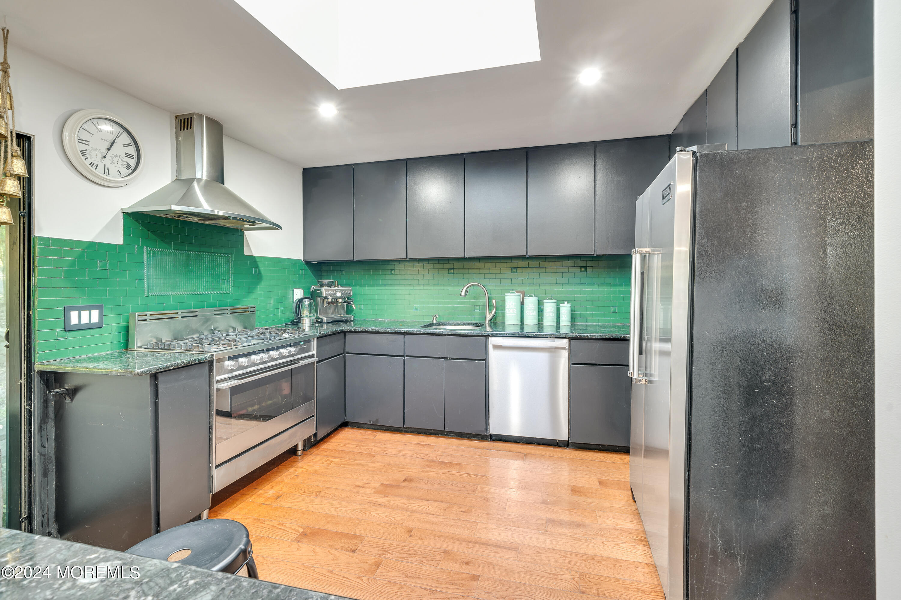 77 Telegraph Hill Road Holmdel, NJ 07733 - Photo 12 of 31 a kitchen with stainless steel appliances granite countertop a refrigerator a stove and a sink