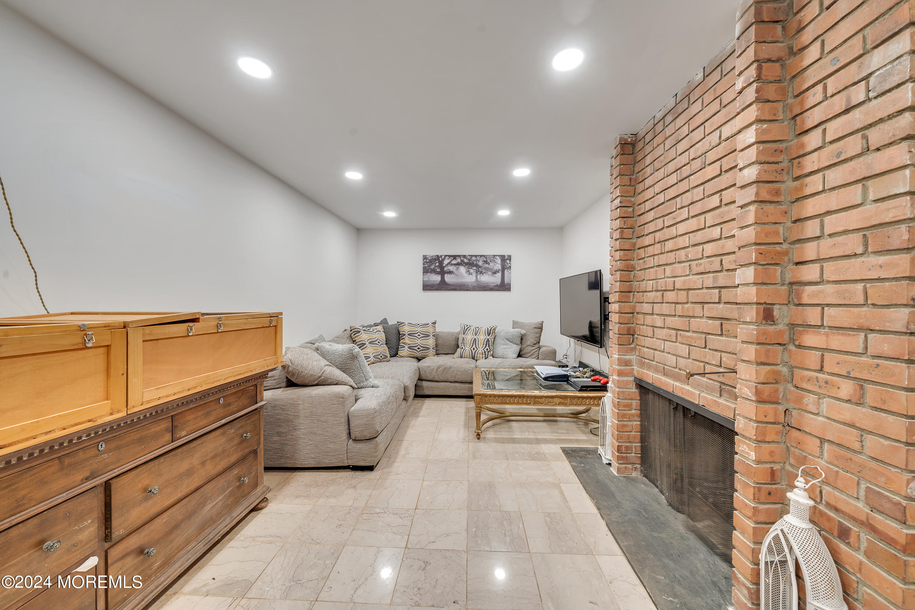 77 Telegraph Hill Road Holmdel, NJ 07733 - Photo 22 of 31 a living room with furniture and a fireplace