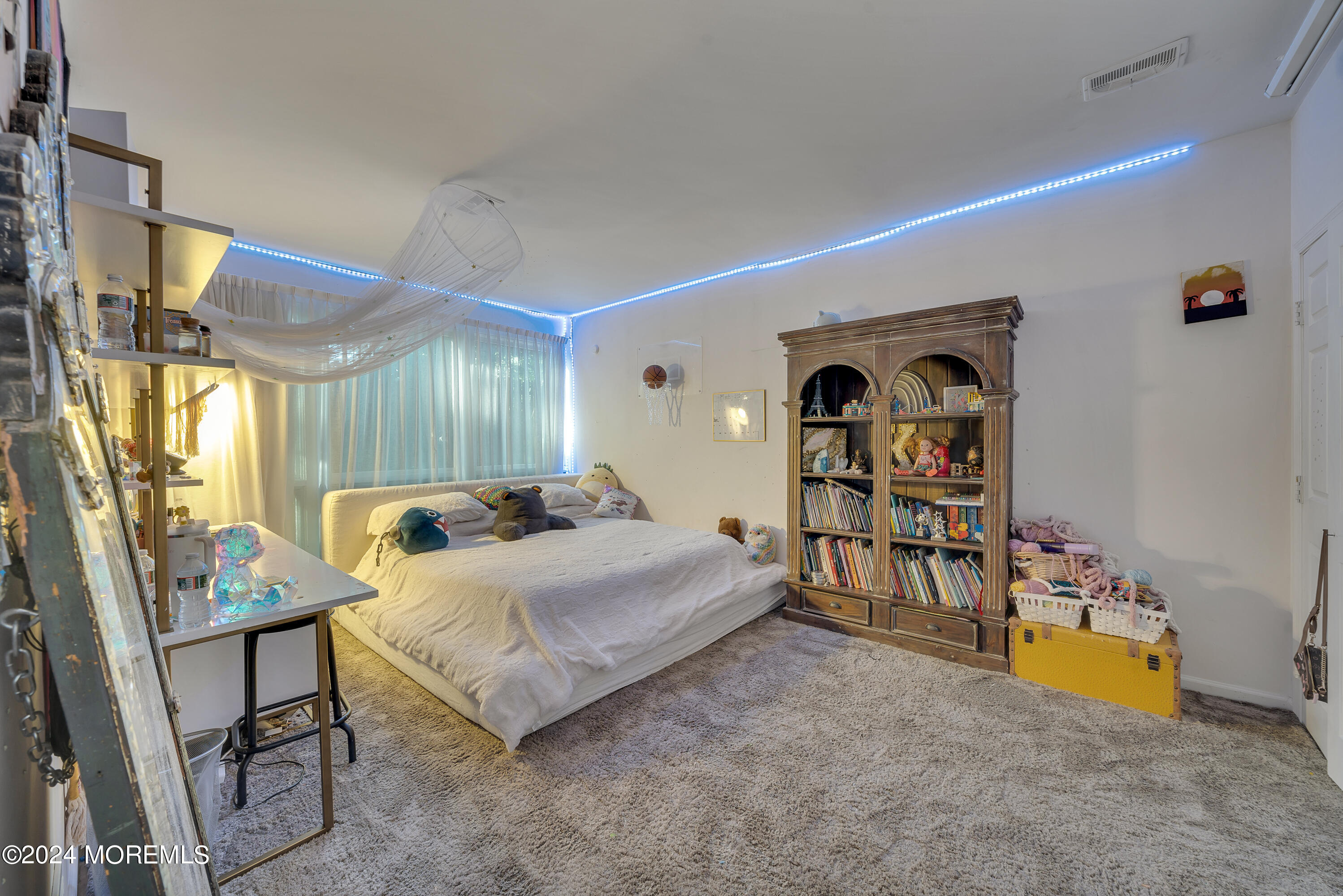 77 Telegraph Hill Road Holmdel, NJ 07733 - Photo 24 of 31 a bedroom with a bed and a table