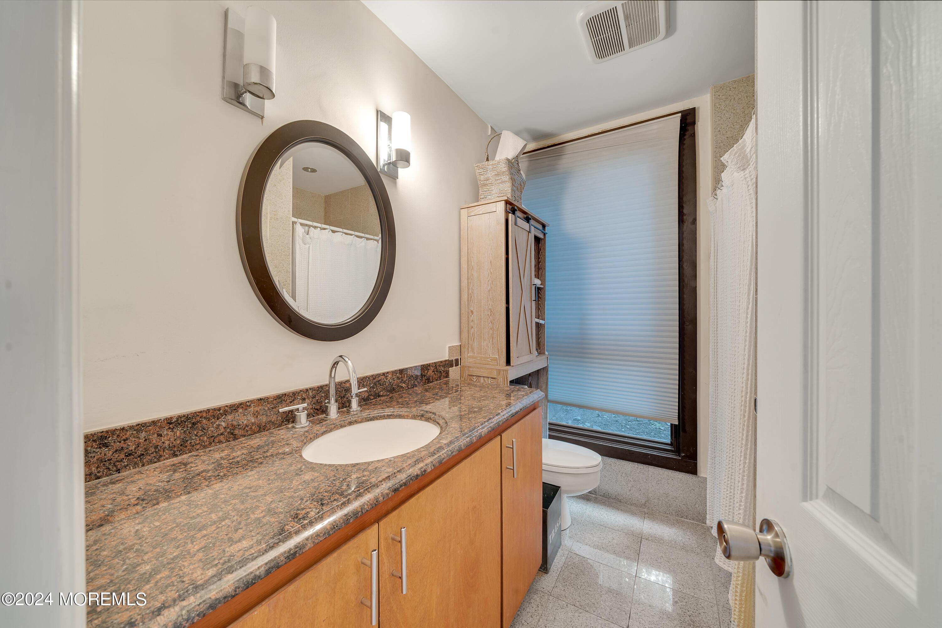 77 Telegraph Hill Road Holmdel, NJ 07733 - Photo 26 of 31 a bathroom with a granite countertop sink and a mirror