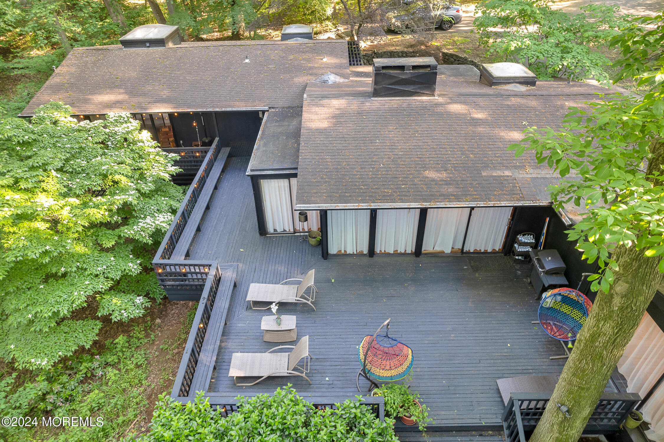 77 Telegraph Hill Road Holmdel, NJ 07733 - Photo 29 of 31 a aerial view of a house with table and chairs in a patio