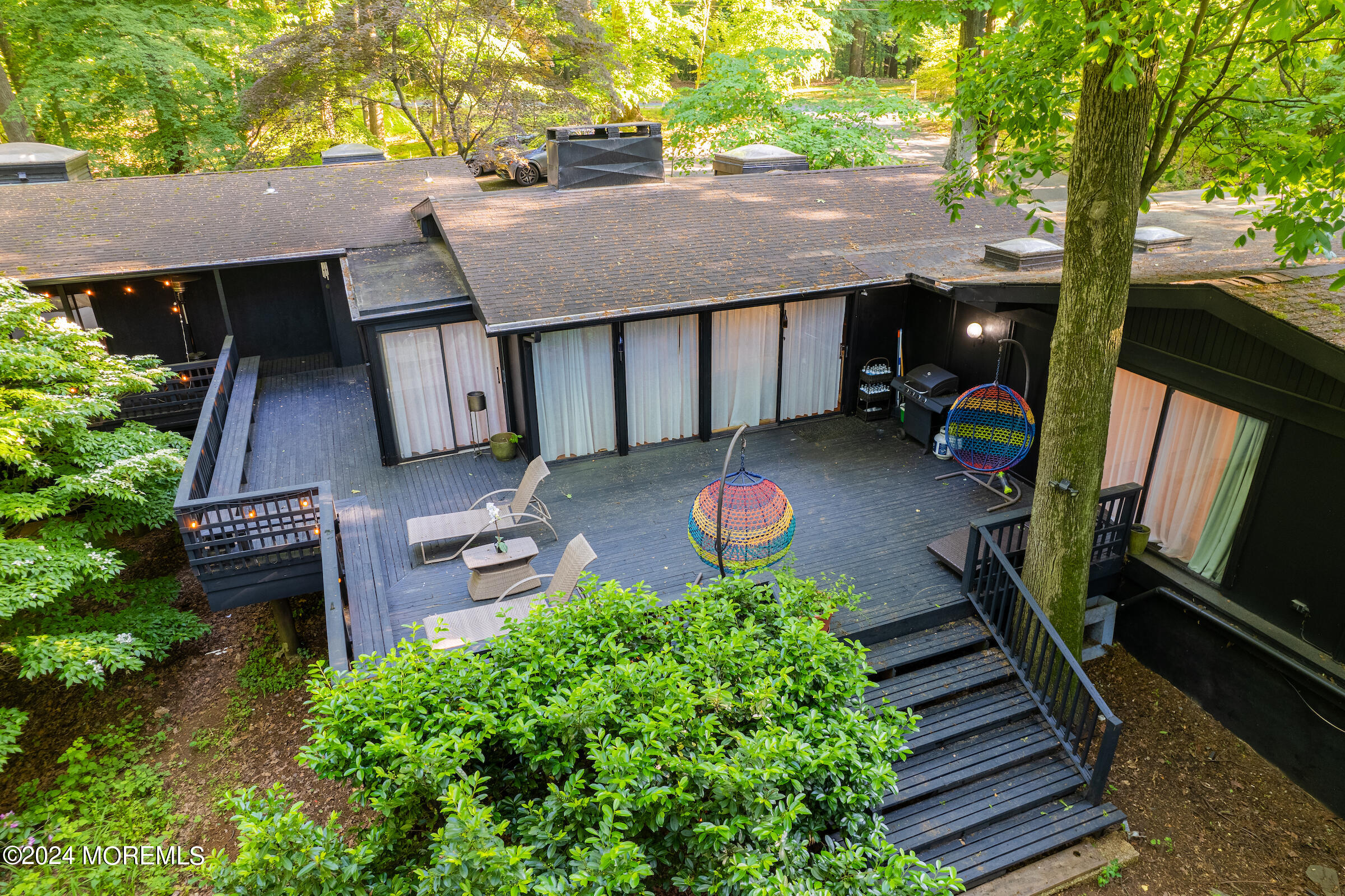 77 Telegraph Hill Road Holmdel, NJ 07733 - Photo 4 of 31 a backyard of a house with seating space