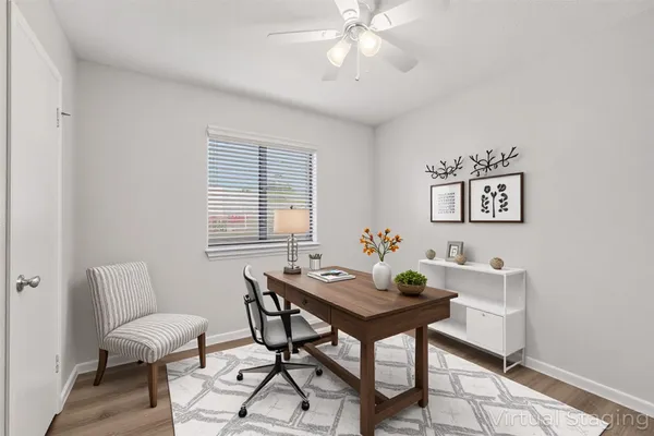 a bedroom with a bed and a table