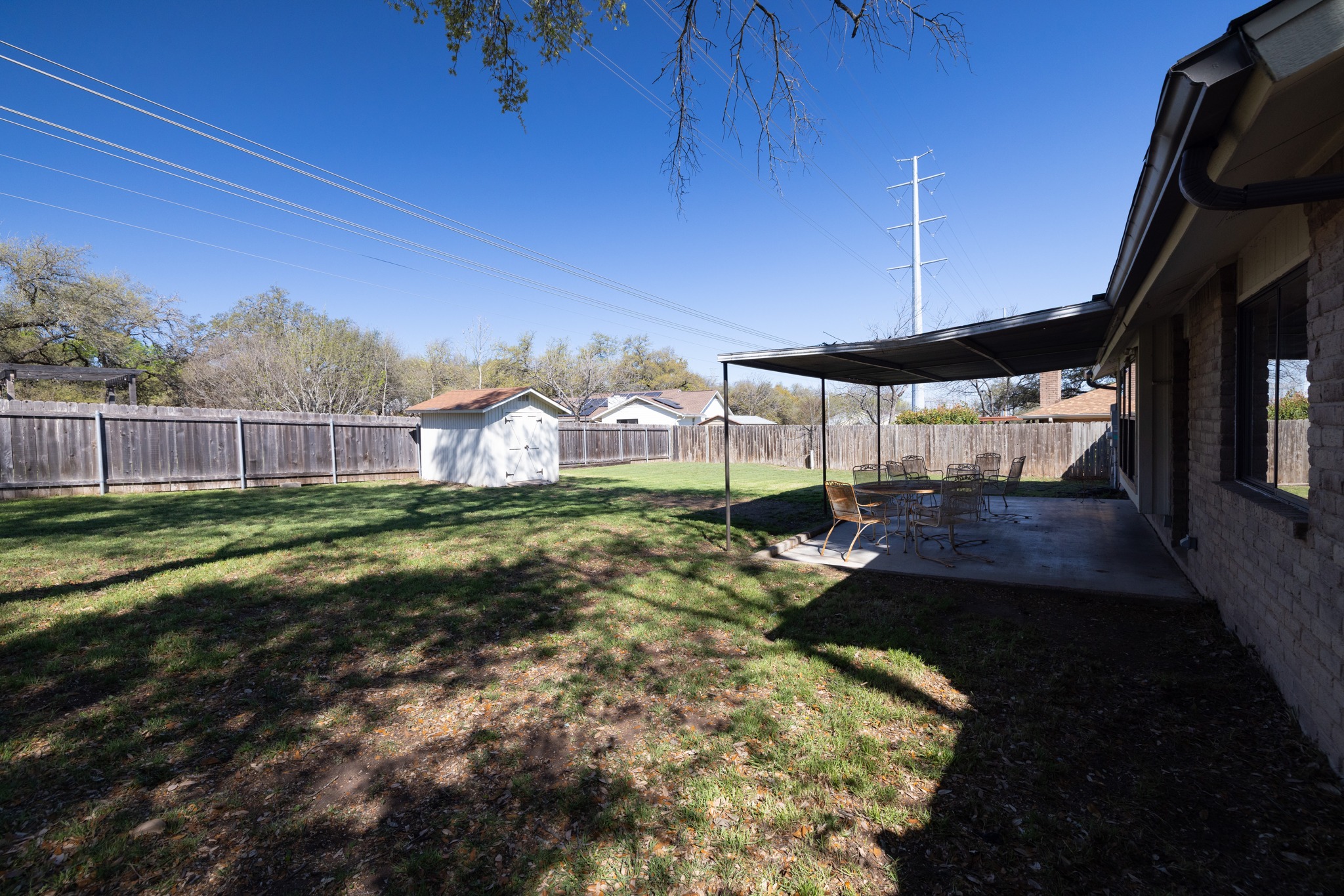 1101 Huntridge Drive Austin, TX 78758 - Photo 28 of 30 Fenced backyard featuring a shed and a patio area