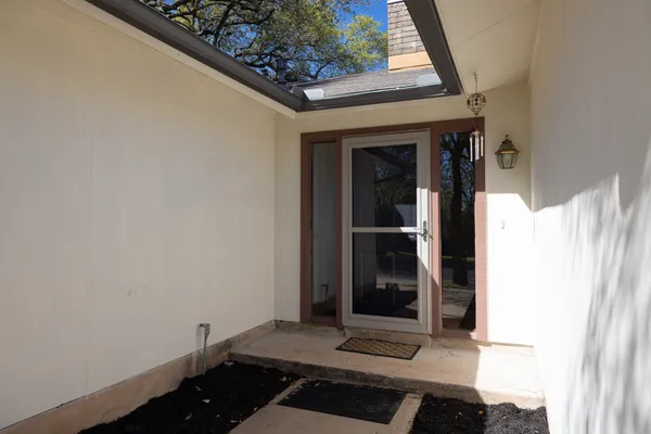 wooden floor in an empty room with a fireplace