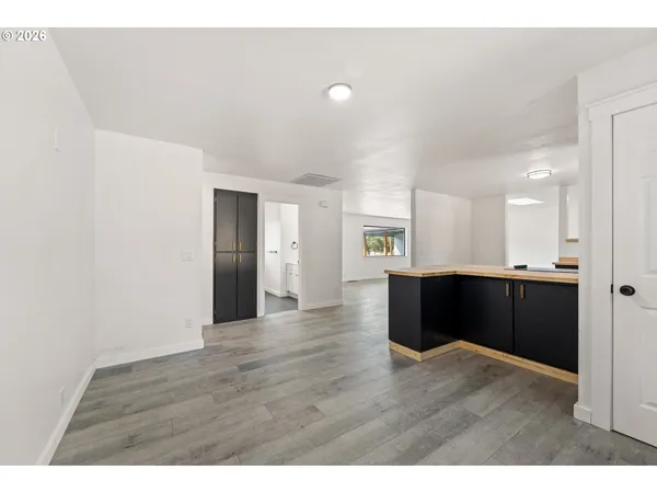 a view interior of kitchen and hall with wooden floor