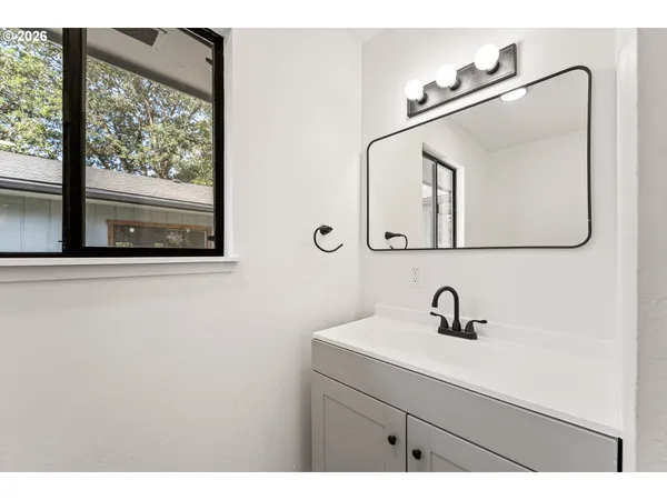 a bathroom with a sink and mirror