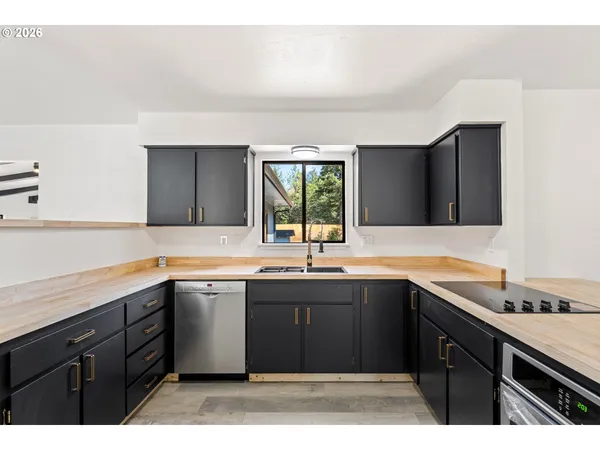 a kitchen with a sink and cabinets