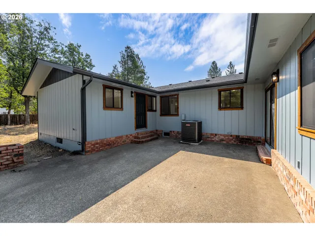 a backyard of a house with yard and garage