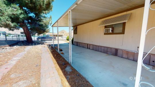 3816 Goat Ranch Road Mountain Mesa, CA 93240 - Photo 19 of 20 a view of a house with a backyard