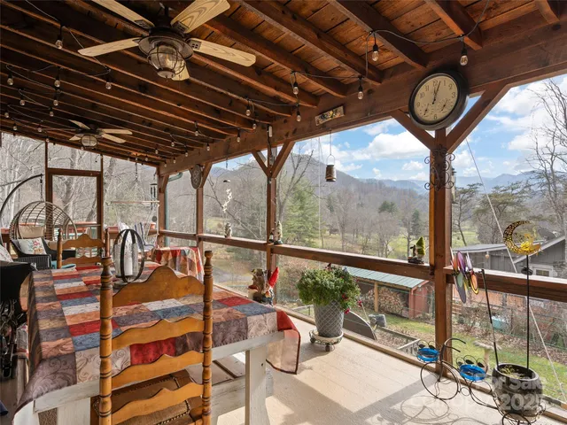 a view of a patio with iron fence