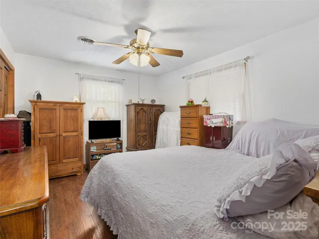 a bathroom with a sink mirror vanity and toilet
