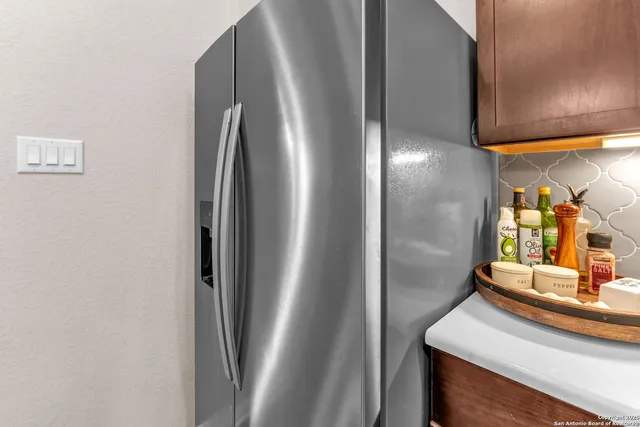 a dining room with furniture and chandelier