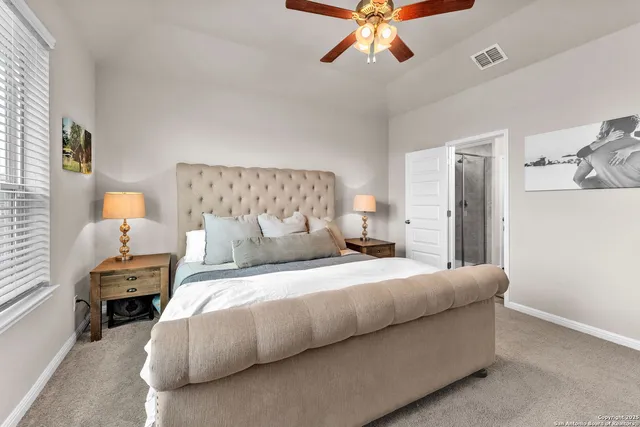 a bathroom with a double vanity sink a mirror and a shower