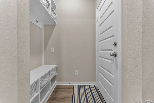 a bathroom with a shower and a sink