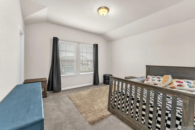 a view of a terrace with furniture and city view