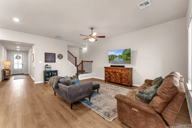 a kitchen with kitchen island granite countertop wooden cabinets and stainless steel appliances