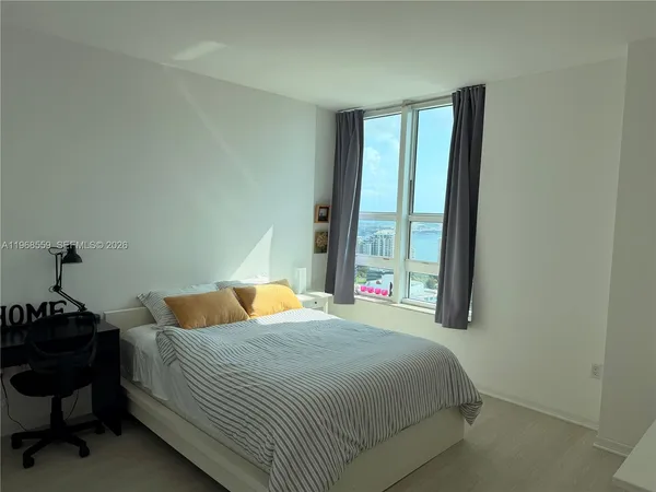 a bathroom with a shower and a toilet