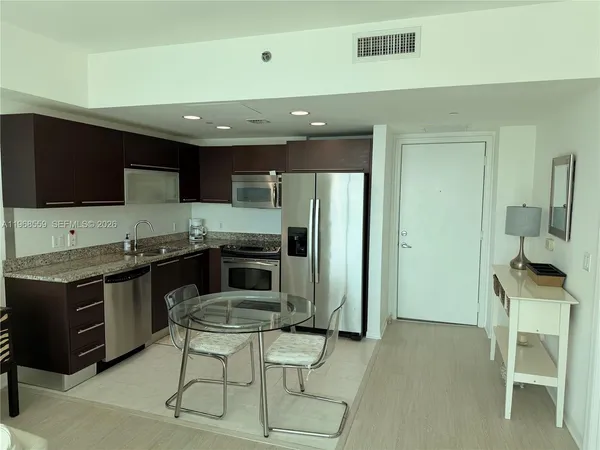 a bathroom with a sink a toilet and a bathtub