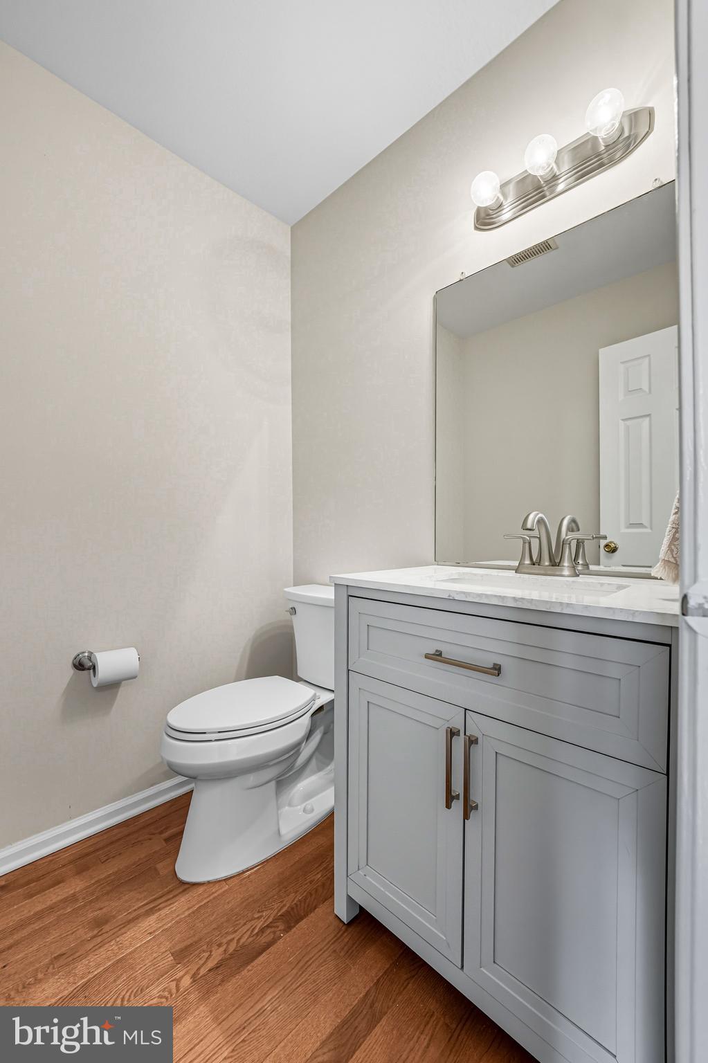 303 Scola Road Brookhaven, PA 19015 - Photo 13 of 56 a bathroom with a sink toilet and mirror