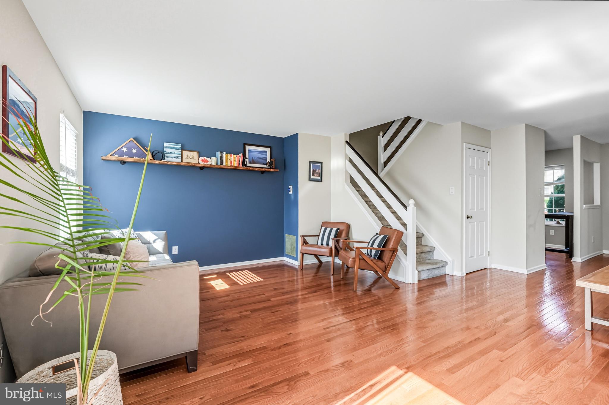 303 Scola Road Brookhaven, PA 19015 - Photo 18 of 56 a living room with furniture wooden floor and a flat screen tv