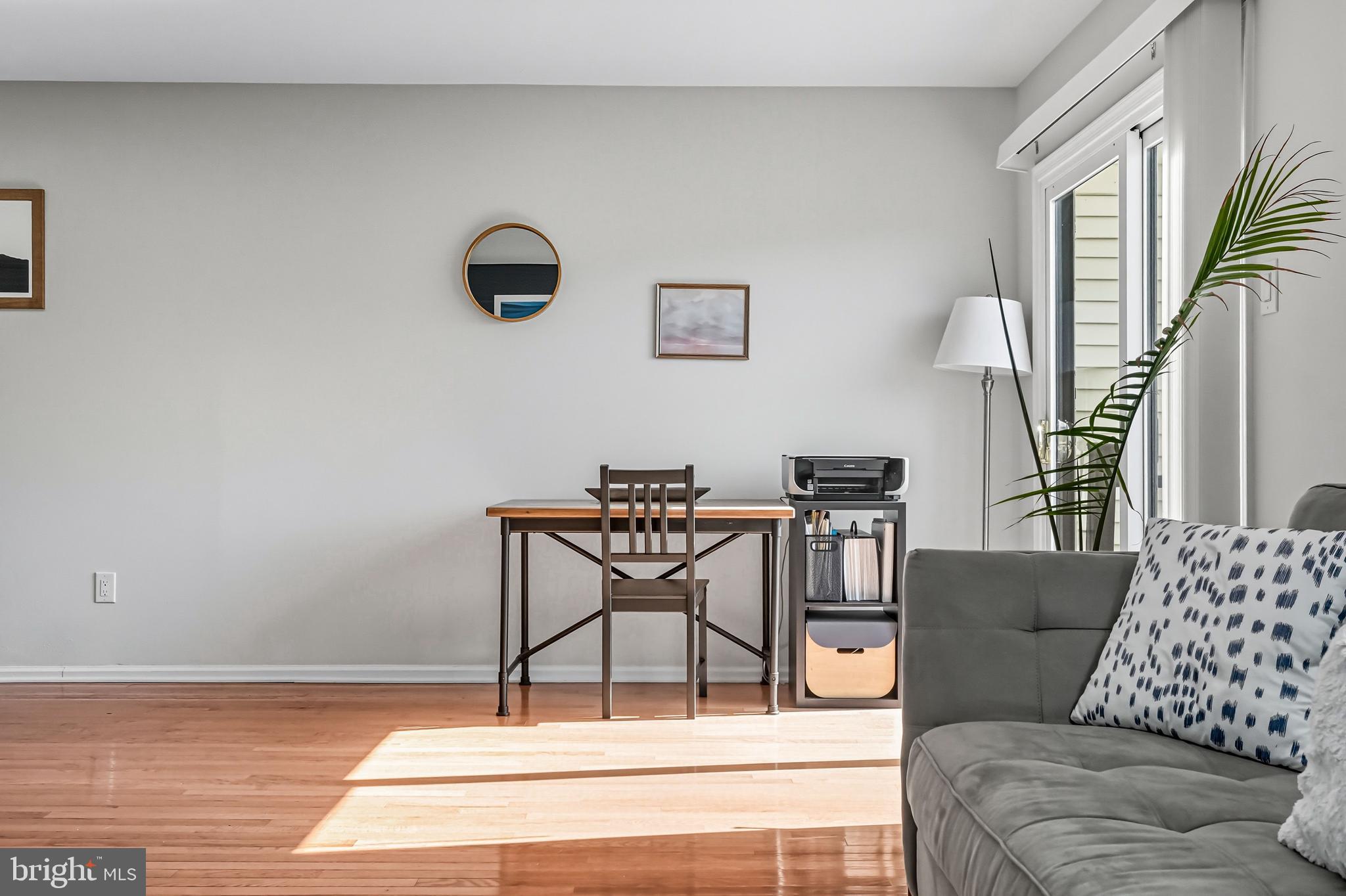 303 Scola Road Brookhaven, PA 19015 - Photo 21 of 56 a living room with furniture and a floor to ceiling window