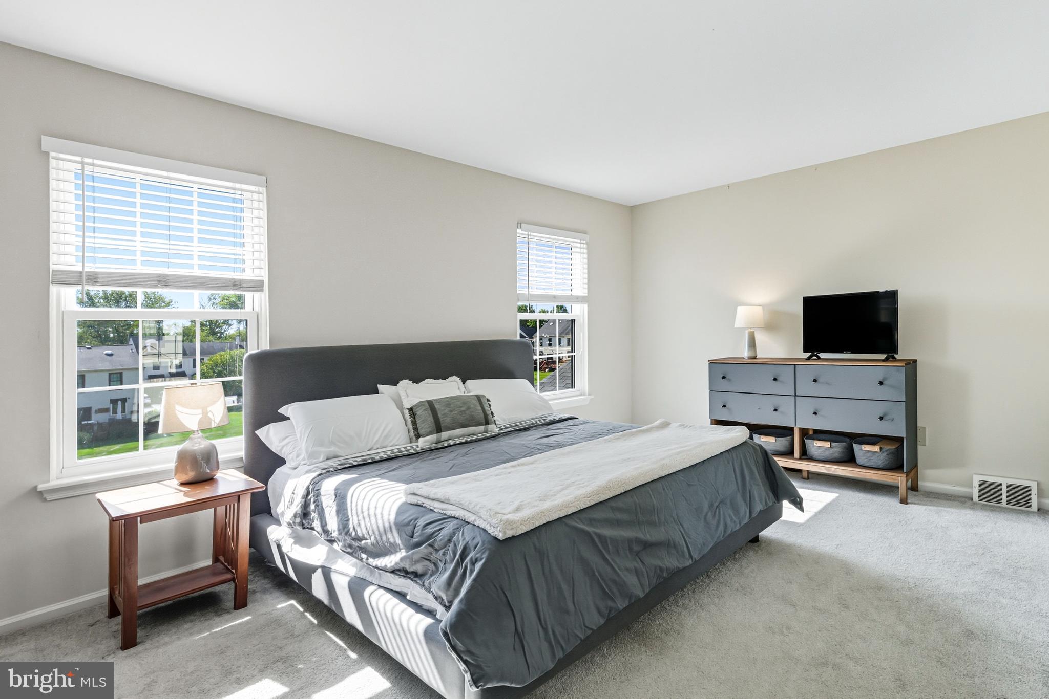 303 Scola Road Brookhaven, PA 19015 - Photo 25 of 56 a bedroom with a bed and a desk
