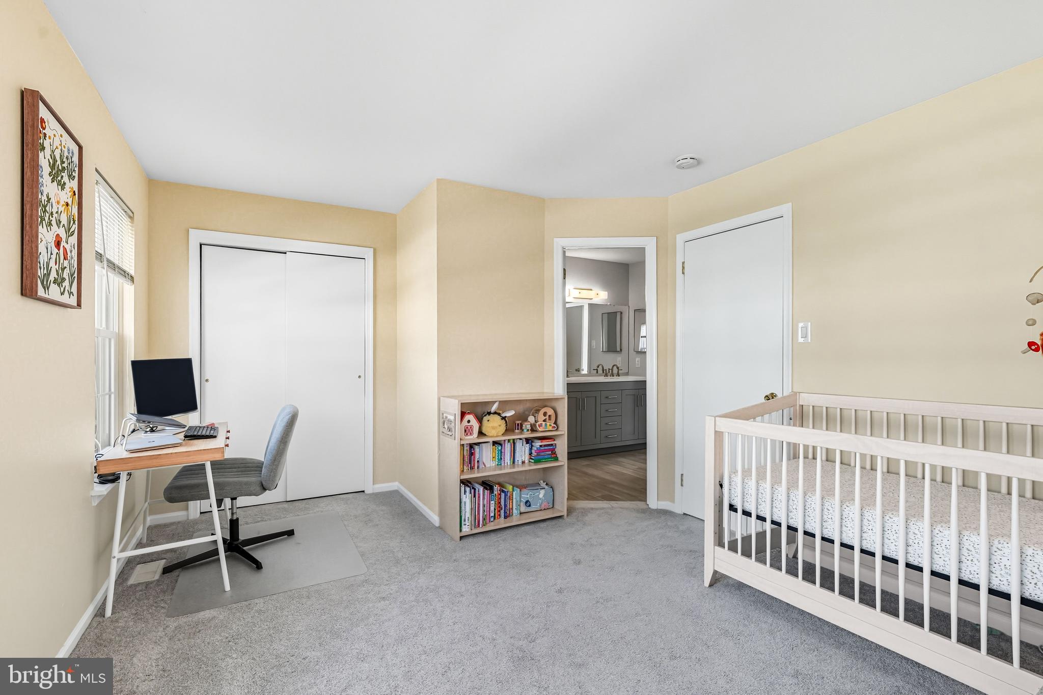 303 Scola Road Brookhaven, PA 19015 - Photo 30 of 56 a view of a bedroom with baby crib and a window