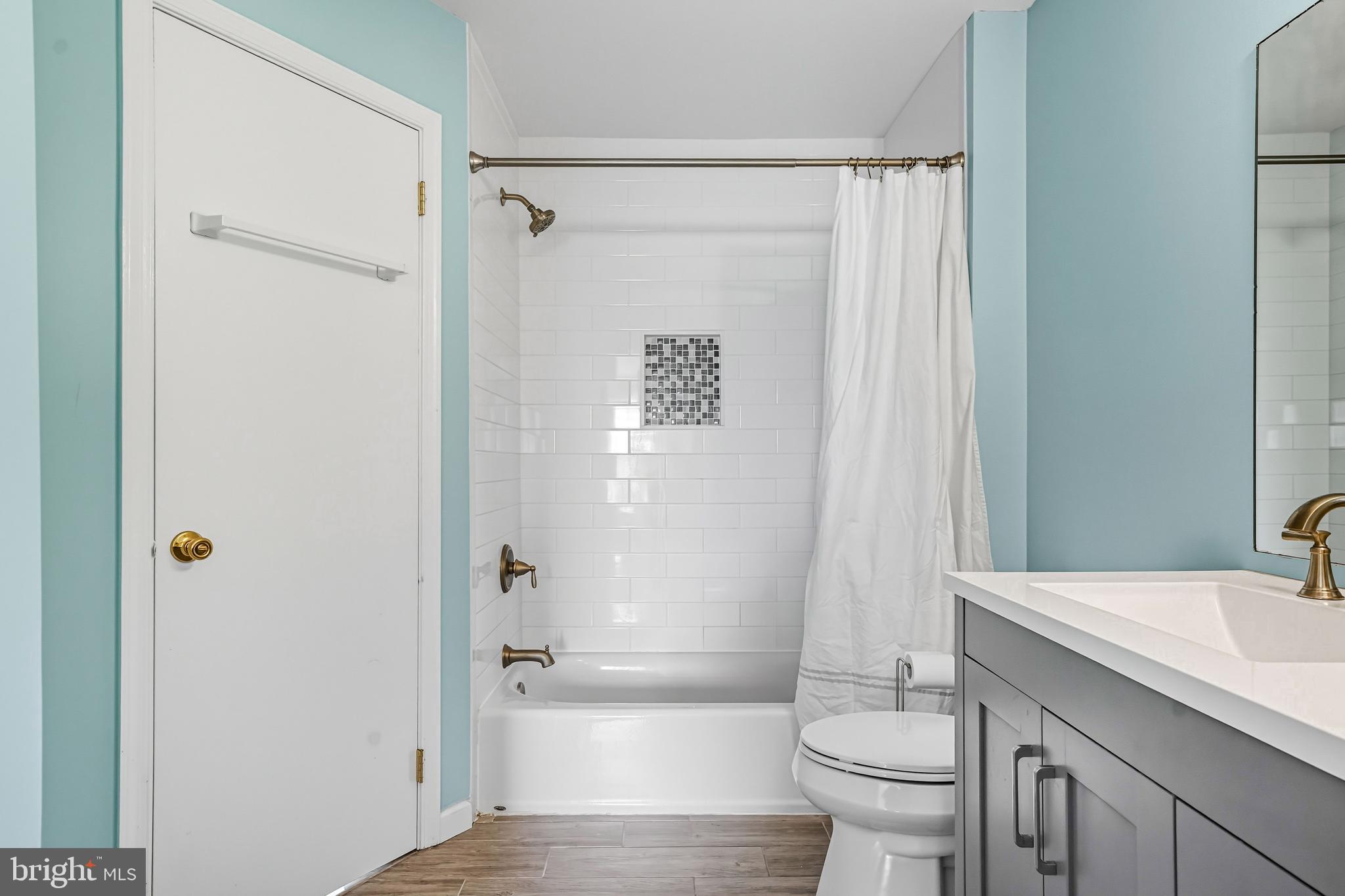 303 Scola Road Brookhaven, PA 19015 - Photo 31 of 56 a bathroom with a granite countertop sink toilet and shower