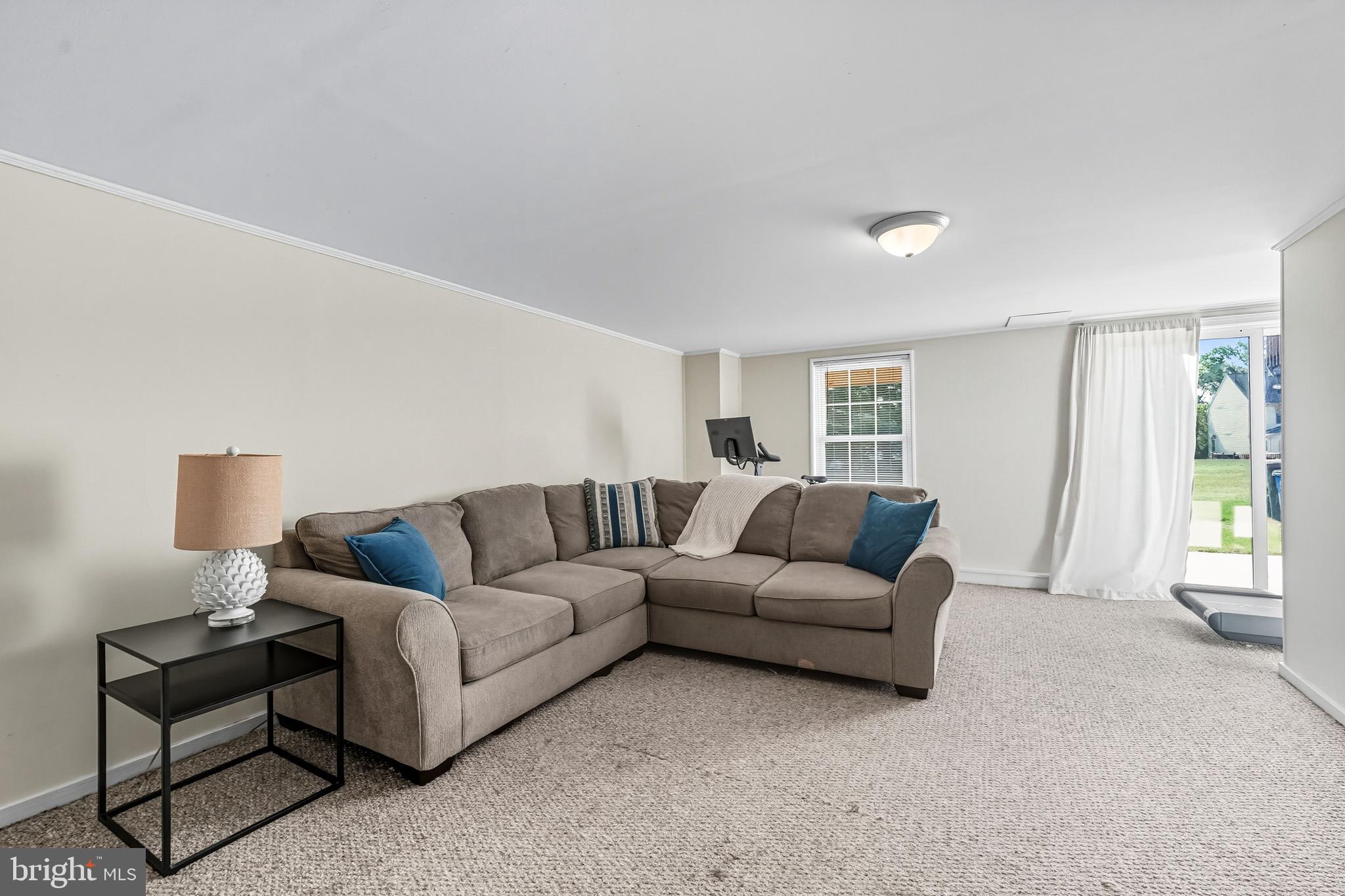303 Scola Road Brookhaven, PA 19015 - Photo 33 of 56 a living room with furniture and a window