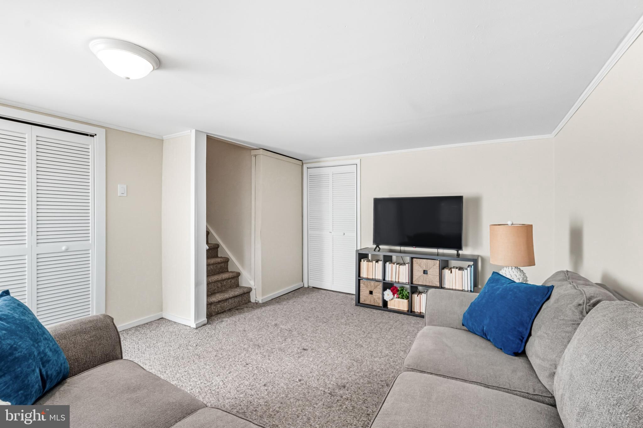 303 Scola Road Brookhaven, PA 19015 - Photo 34 of 56 a living room with furniture and a flat screen tv