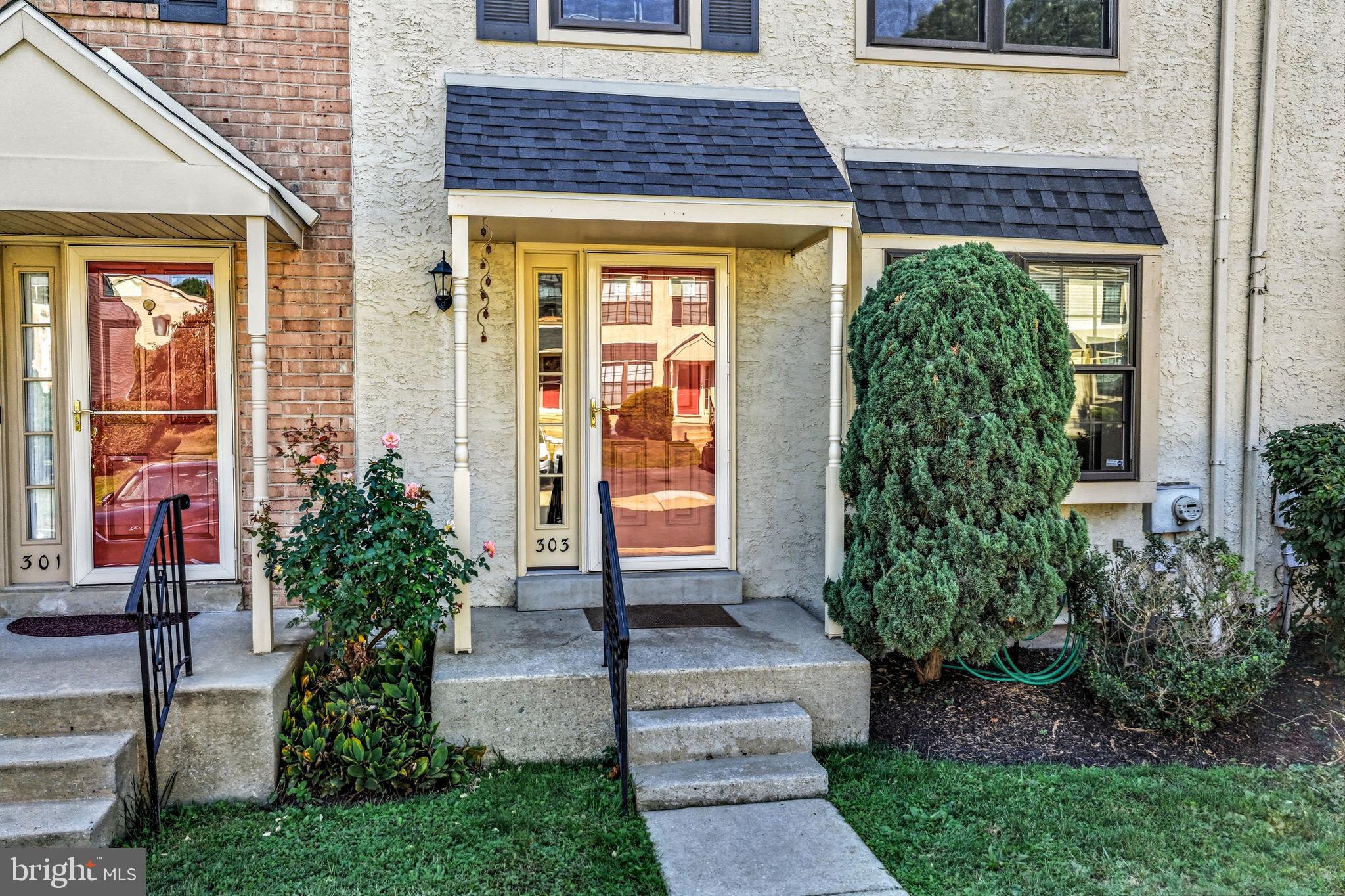 303 Scola Road Brookhaven, PA 19015 - Photo 4 of 56 a front view of a house with garden