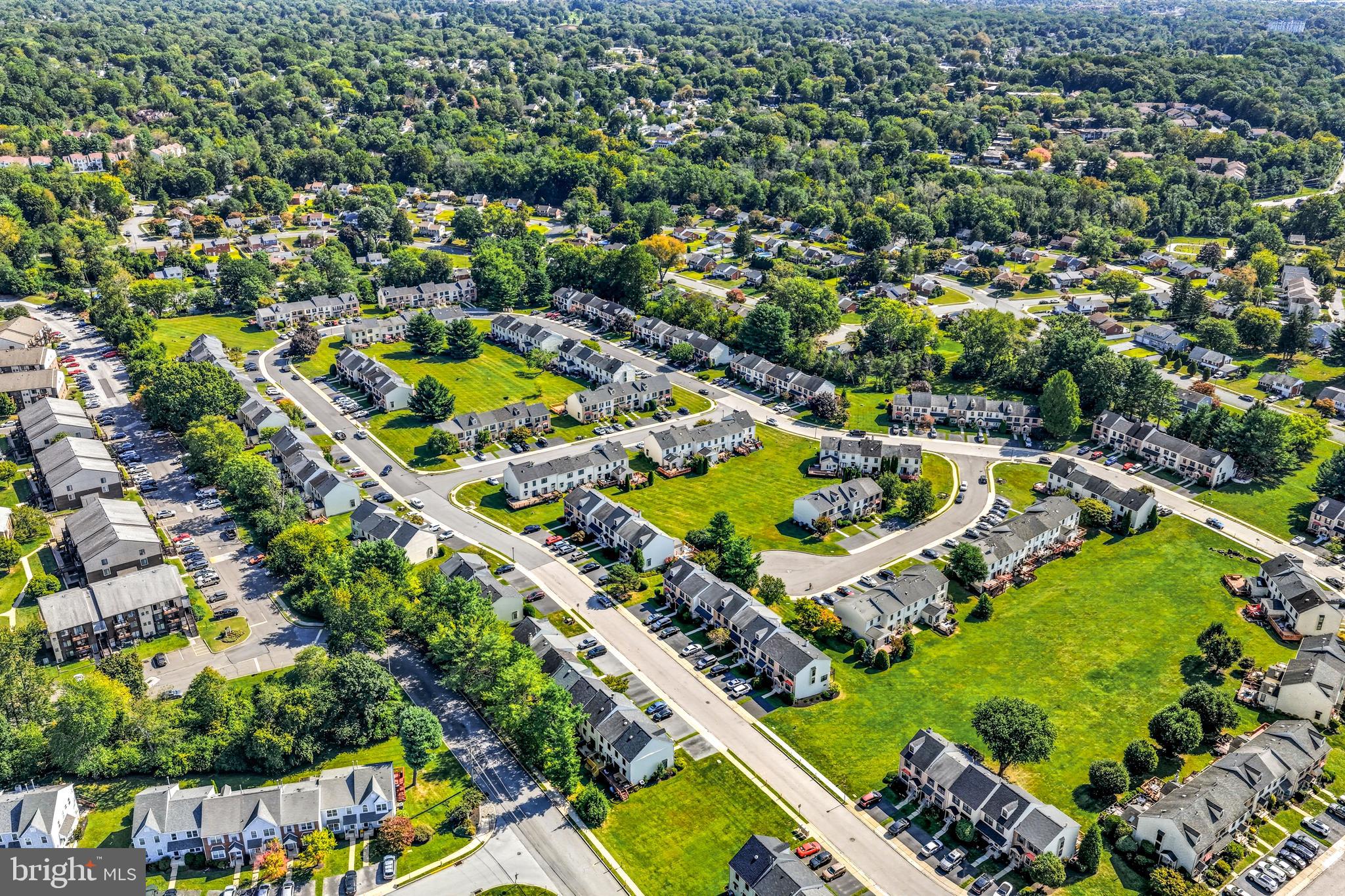 303 Scola Road Brookhaven, PA 19015 - Photo 50 of 56 an aerial view of residential houses with outdoor space and swimming pool