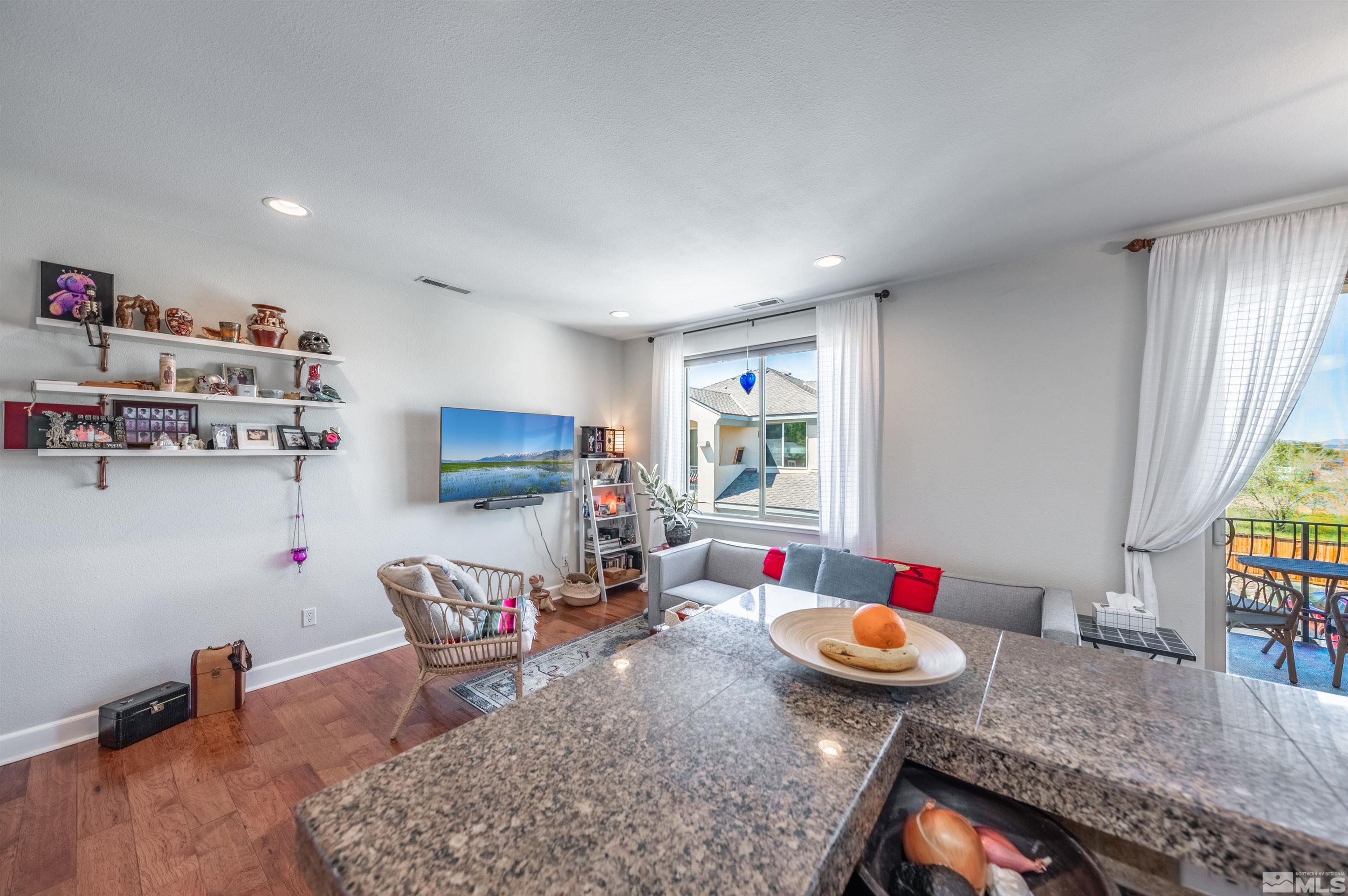 3677 Warren Way, Unit C Reno, NV 89509 - Photo 11 of 23 a living room with furniture and a wooden floor
