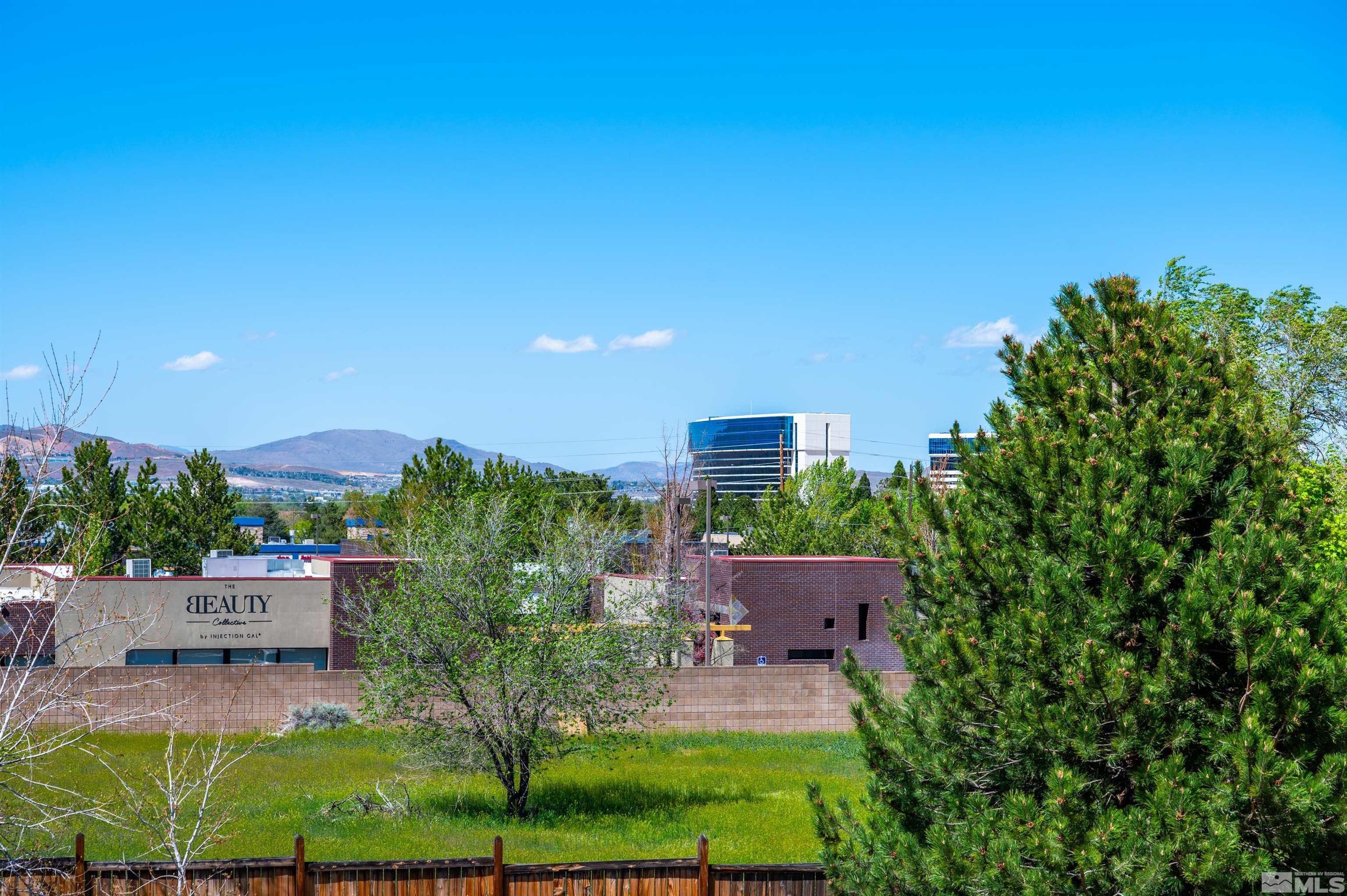 3677 Warren Way, Unit C Reno, NV 89509 - Photo 22 of 23 a building view with a garden space