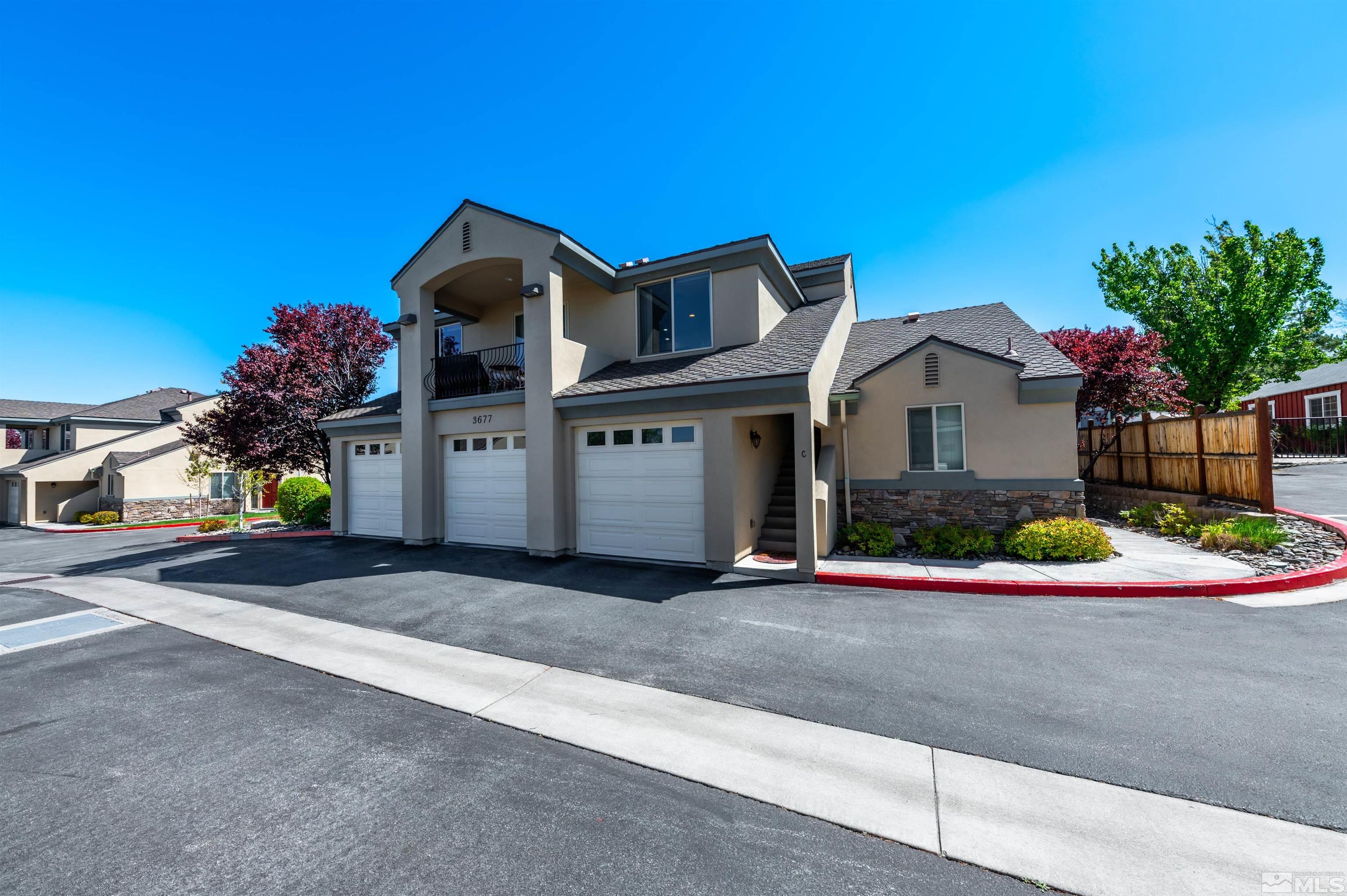 3677 Warren Way, Unit C Reno, NV 89509 - Photo 3 of 23 a front view of a house with a garage